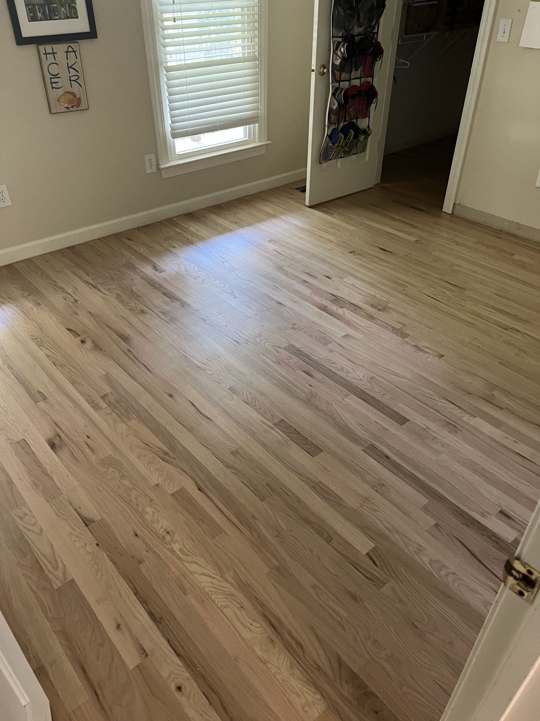 Wide-plank floor installed through a hallway