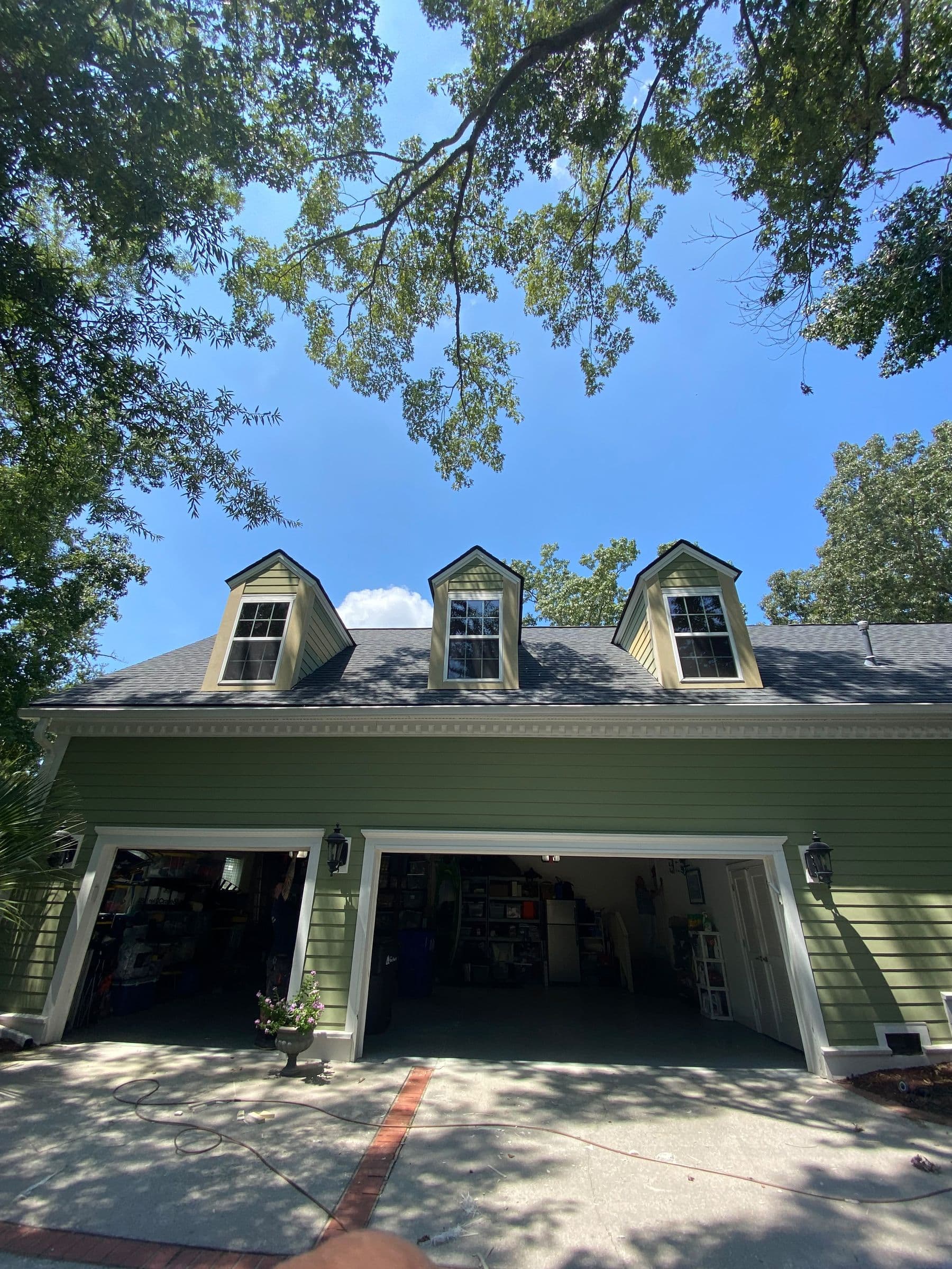 Siding and trim on a Cape-style house with dormers
