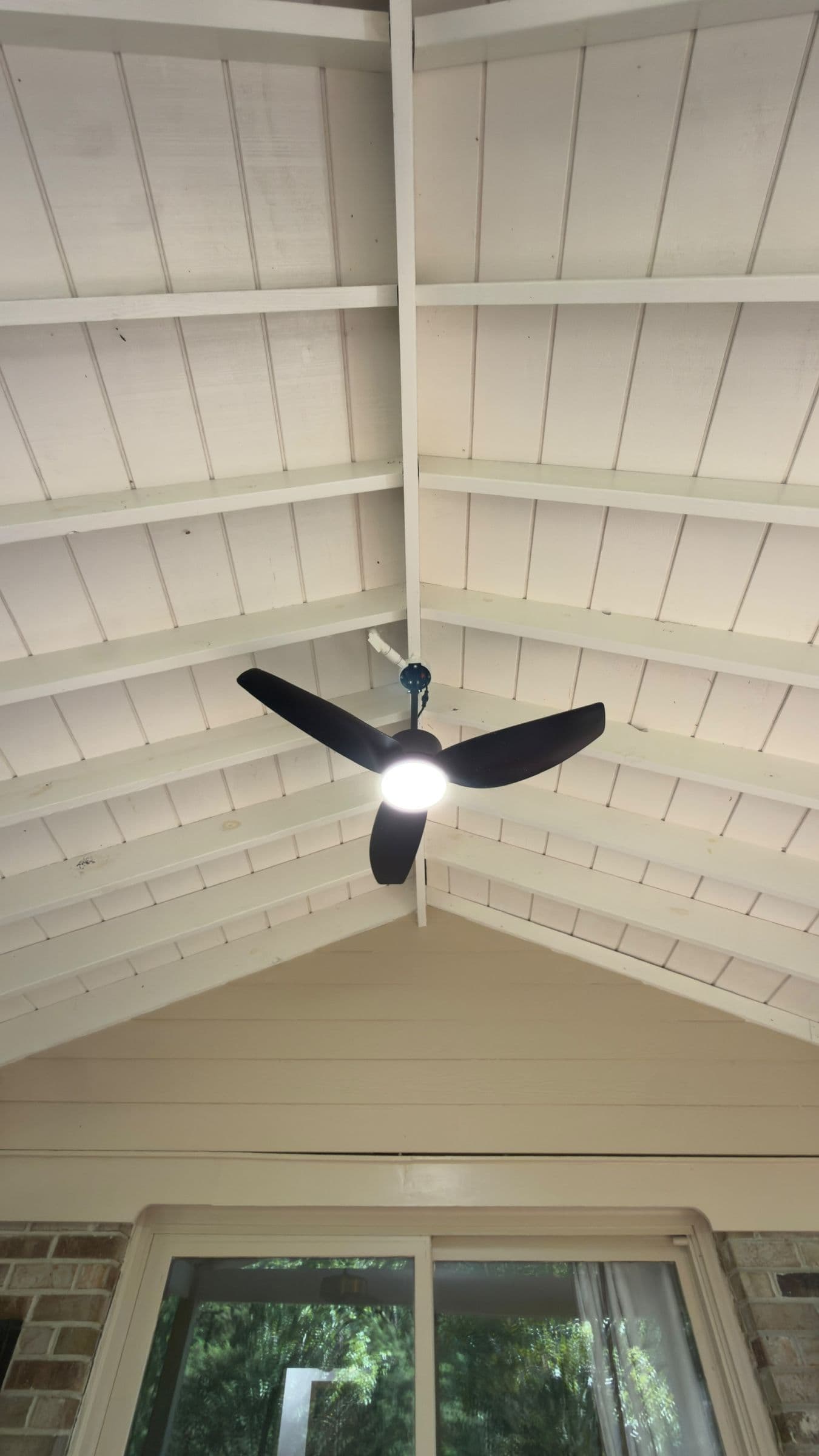 Vaulted tongue-and-groove porch ceiling over a pool deck